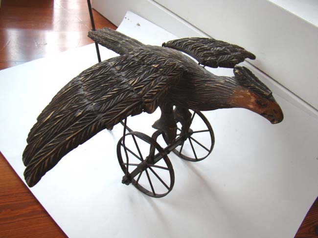 A late Victorian carved wooden spread wing eagle push toy — image 8